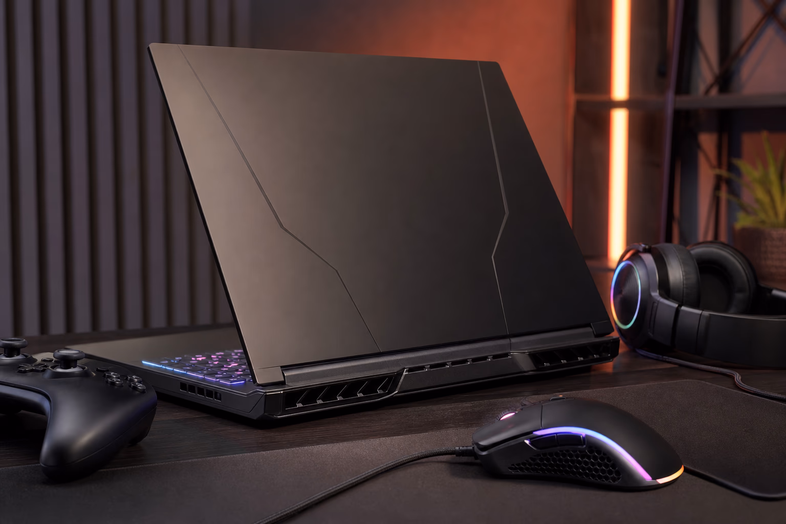Large gaming laptop setup with cooling vents and gaming accessories