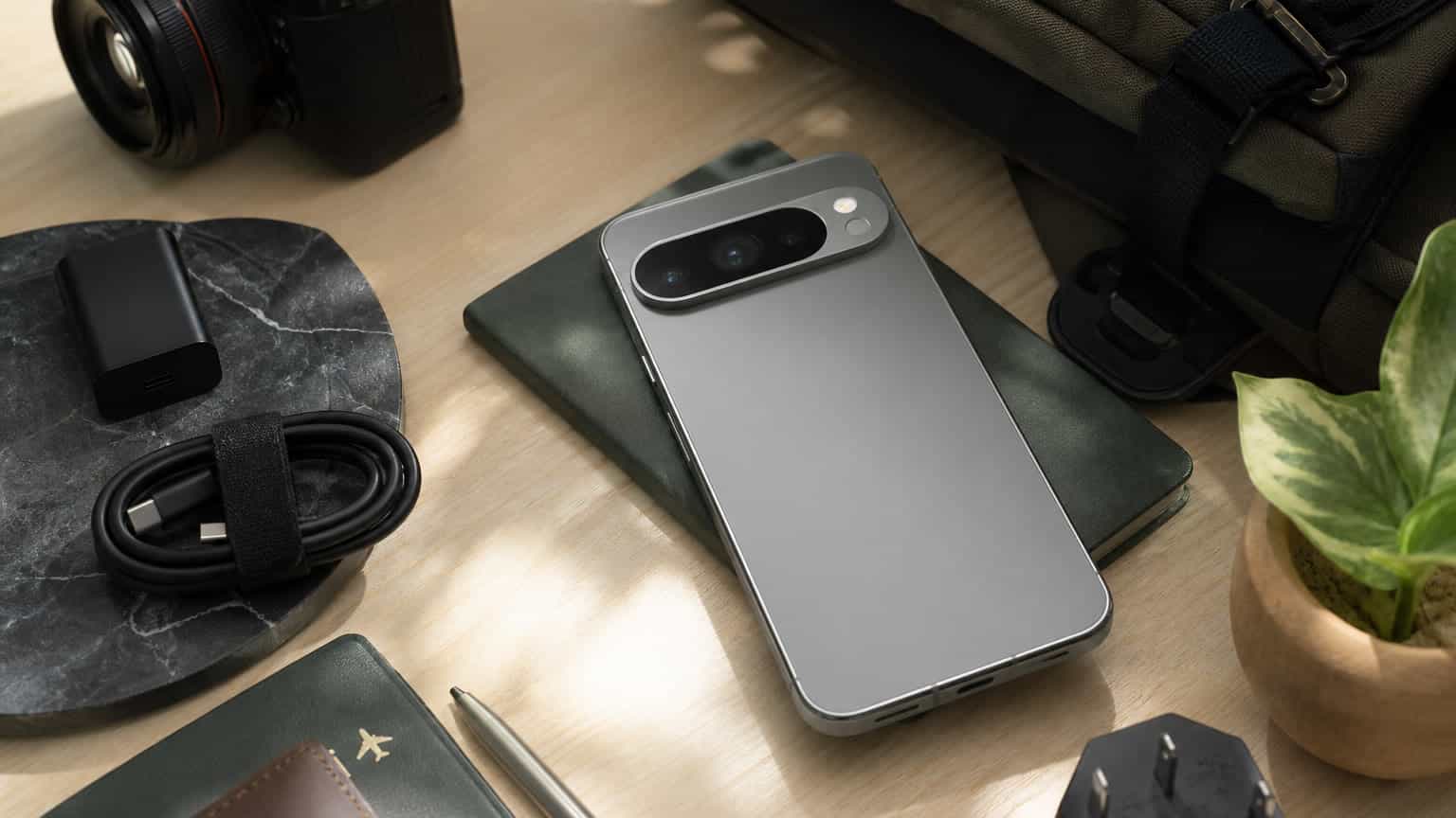 Premium Pixel-style smartphone on a desk with camera and charging accessories