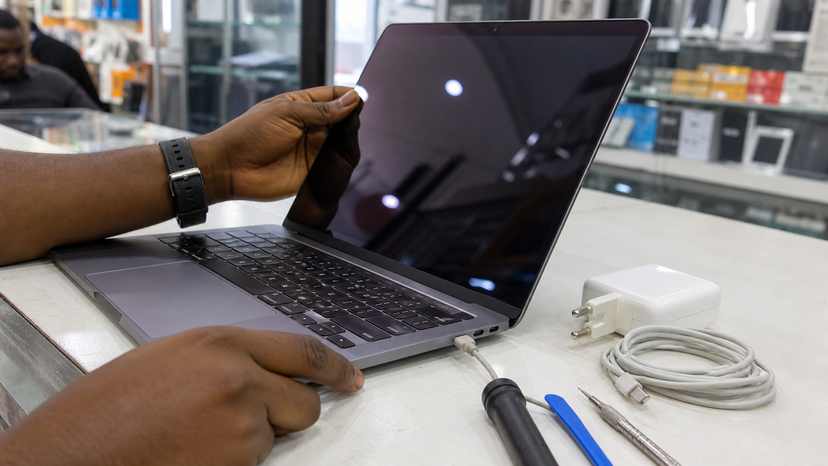 Close inspection of a used MacBook display keyboard and USB-C charging port