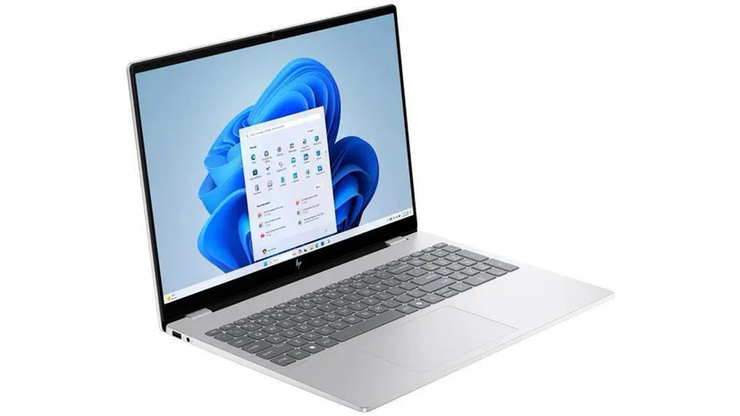 Laptop side profile with common ports and charging accessories arranged on a desk
