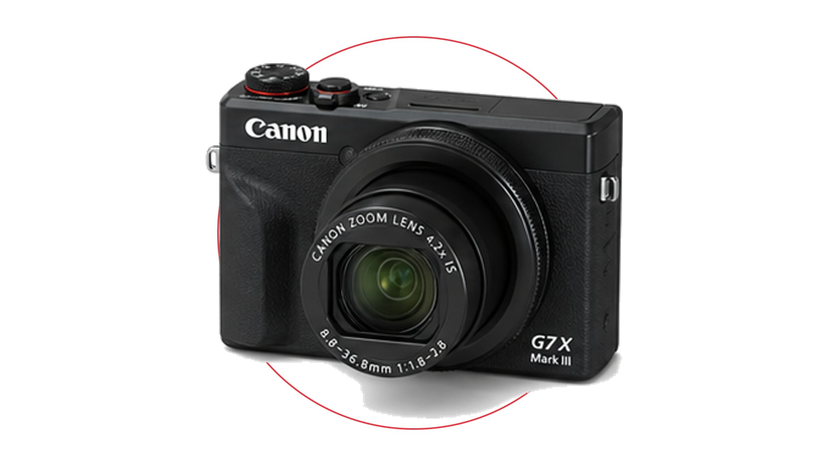Compact vlogging camera setup with microphone, small tripod and travel accessories