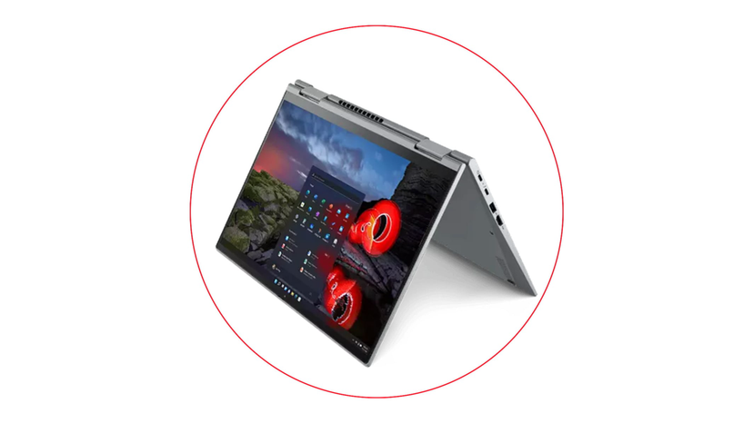 USB-C charger, laptop ports and stylus arranged beside a business laptop