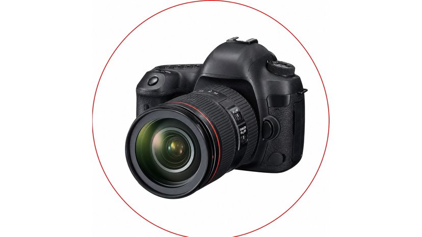 Canon DSLR camera body beside a 24-105mm standard zoom lens and memory cards